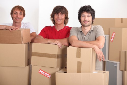 Professional team handling office furniture during a move