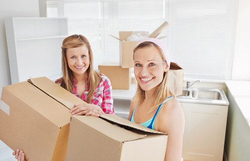 Packed boxes and furniture ready for collection by movers in Toedinburgh